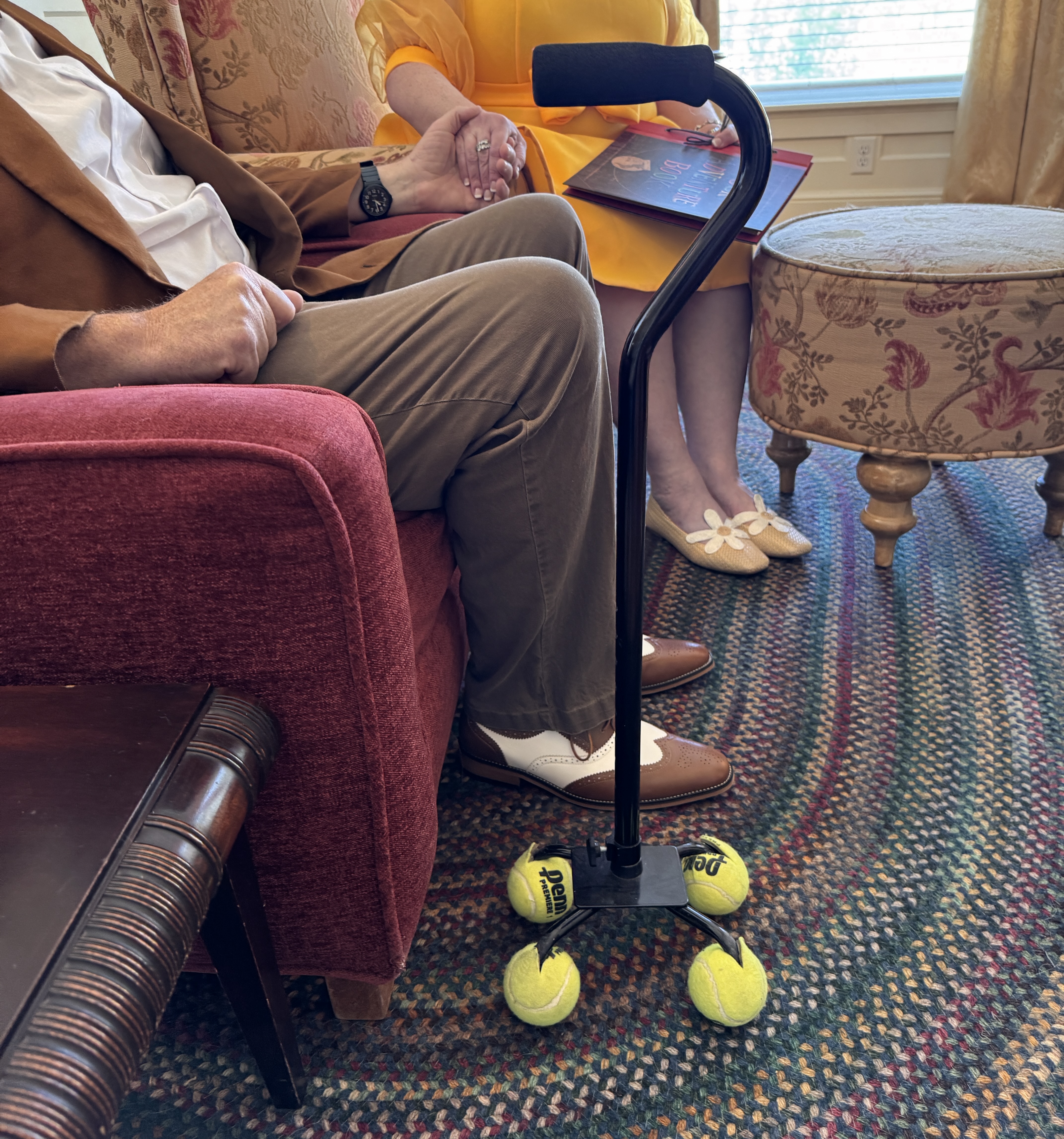 carl and ellie sitting holding hands